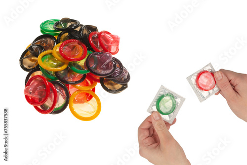 Condom in woman hand isolated on white background.