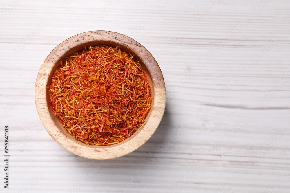 Aromatic saffron in bowl on table, top view. Space for text Aromatic saffron in bowl on table, top view. Space for text