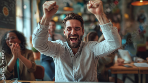 Exuberant Businessman Celebrating Success with Colleagues at a Vibrant Office Party