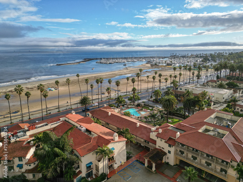Aerial drone shot overlooking West Beach, Santa Barbara Harbor and Cabrillo Blvd. in Santa Barbara, California on a sunny afternoon.