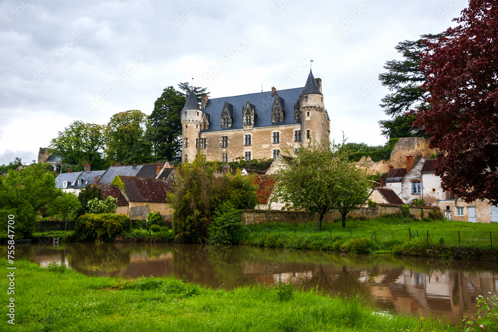 Picturesque view of Montresor village with its old castle and  Indrois river in moody spring day. Indre-et-Loire, France. Montresor is listed as one of most beautiful villages in France. 