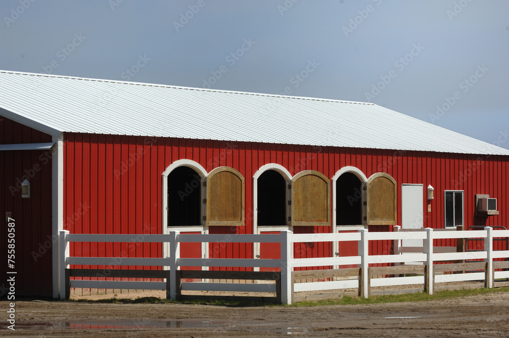 Red barn aluminum sided with curved windows and doors opening to ...