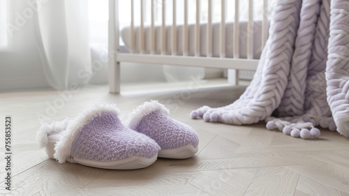 Delicate lavender slippers with fuzzy edges, adding a touch of whimsy to the elegant parquet flooring in a cozy nursery. photo