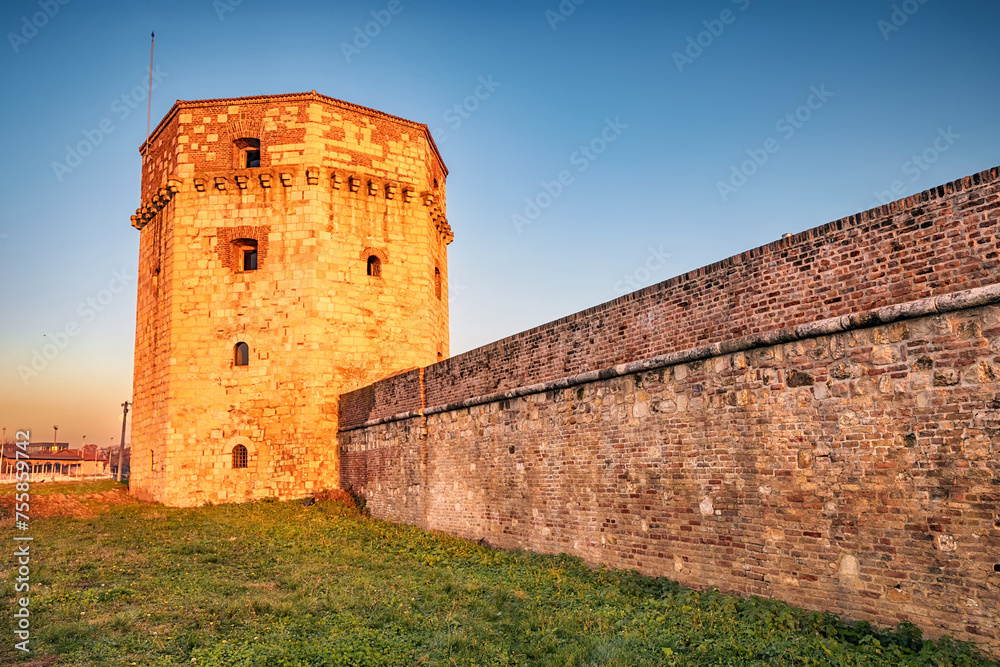 Kalemegdan fortress in Belgrade to experience its ancient walls, defensive towers, and panoramic views of the Balkans as the sun sets over the historic park.