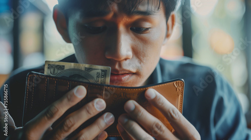 Debt financial concept, stressed problem people asian man, male hand open empty wallet not have budget of money to pay no have credit card, not able payment bill, loan or expense with bank, bankruptcy photo