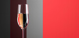 A crystal-clear cider, effervescent and light, in a slender flute, with a ruby red and charcoal grey background