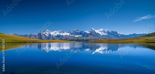A crisp, a serene, alpine lake reflecting a perfect, snow-capped mountain range under a crystal-clear blue sky, embodying peaceful solitude