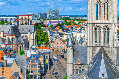 Saint Nicholas Church Sint-Niklaaskerk tower and Saint Michael's Roman Catholic Church Sint-Michielskerk background in Ghent city historical centre Gent old town, East Flanders province, Belgium photo