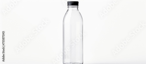 A transparent plastic bottle filled with liquid, with a sleek black cap, set against a clean white background. A modern drinkware option © AkuAku