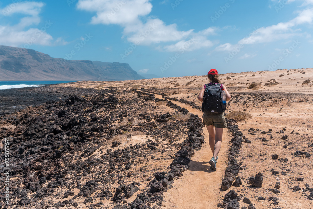 Girl hiking on La Graciosa Island, sustainable travel escape destination healty lifestile Canary Islands Spain
