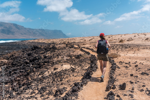 Girl hiking on La Graciosa Island, sustainable travel escape destination healty lifestile Canary Islands Spain