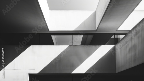 The stark lines of modern architecture captured in a dramatic black and white photograph.