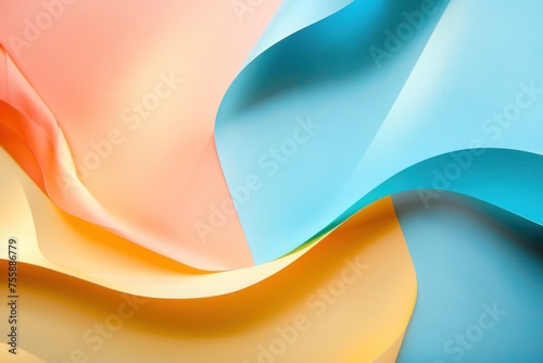 A colorful piece of paper with a wave pattern. The colors are orange, yellow, and blue