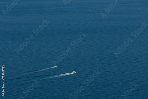 Due barche a motore solcano il Mar Ligure al largo di Montemarcello in provincia di La Spezia.