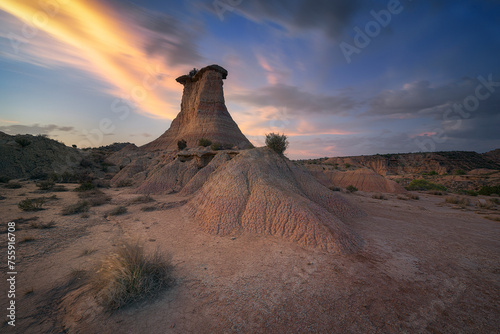 Sunset in the Monegros desert, Zaragoza, with the Tozal El Solitario under a sky of warm colors photo