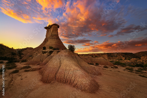 Sunset in the Monegros desert, Zaragoza, with the Tozal El Solitario under a sky of warm colors photo