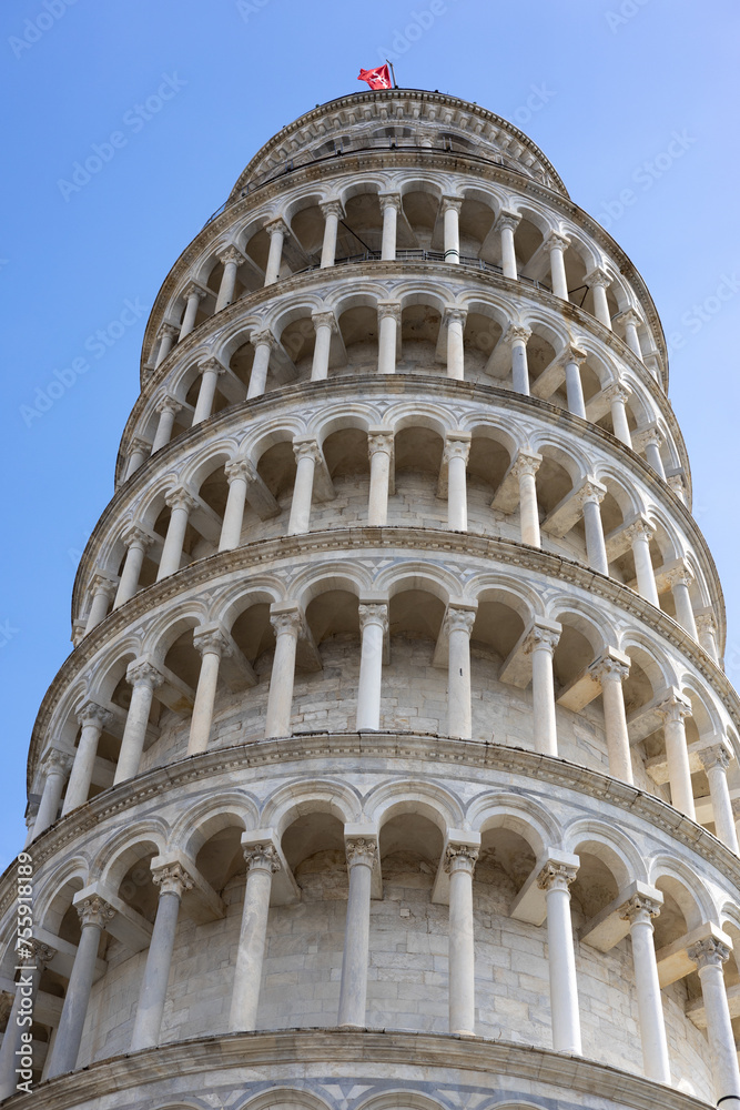 Architectural details of the famous leaning tower of Pisa. Concept of travel, tourism and vacation in city.