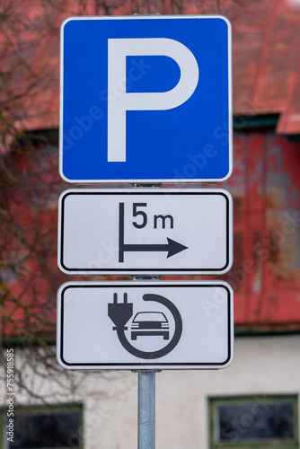 signs indicate the electric car charging point