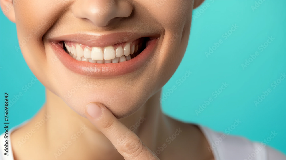 Obraz premium Dentistry, Woman with beautiful teeth. Close-up photo. Woman with beautiful teeth. Pointing finger at his own bright smile. Advertising image.