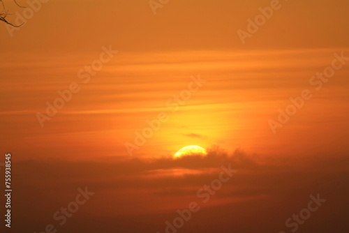 Fototapeta Naklejka Na Ścianę i Meble -   Orange sunset with clouds