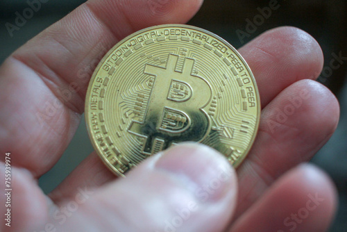 touching a bitcoin with my fingers