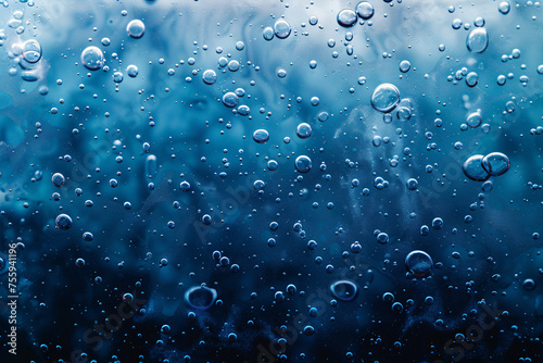 Multiple air bubbles in water with a gradient blue background
