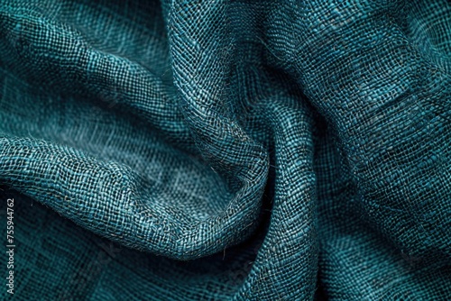 Close up shot of a teal colored fabric, suitable for backgrounds or textures.