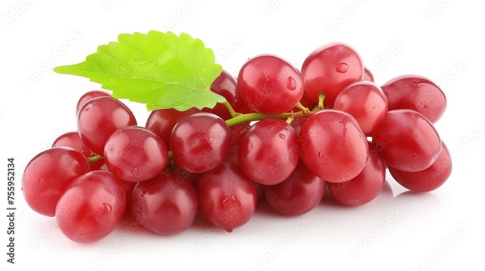 a bunch of red grapes with a green leaf on a white background with a clipping path to the top of the image.