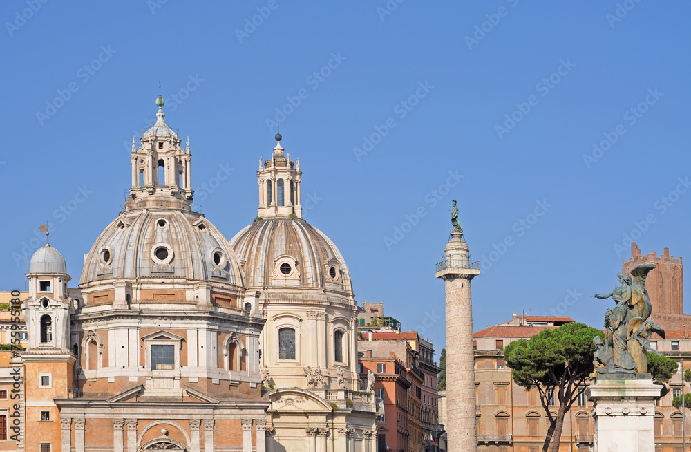View on Piazza Venezia (Venice Square) with Trajan's Column and Domes of the National Museum in Rome with blue sky