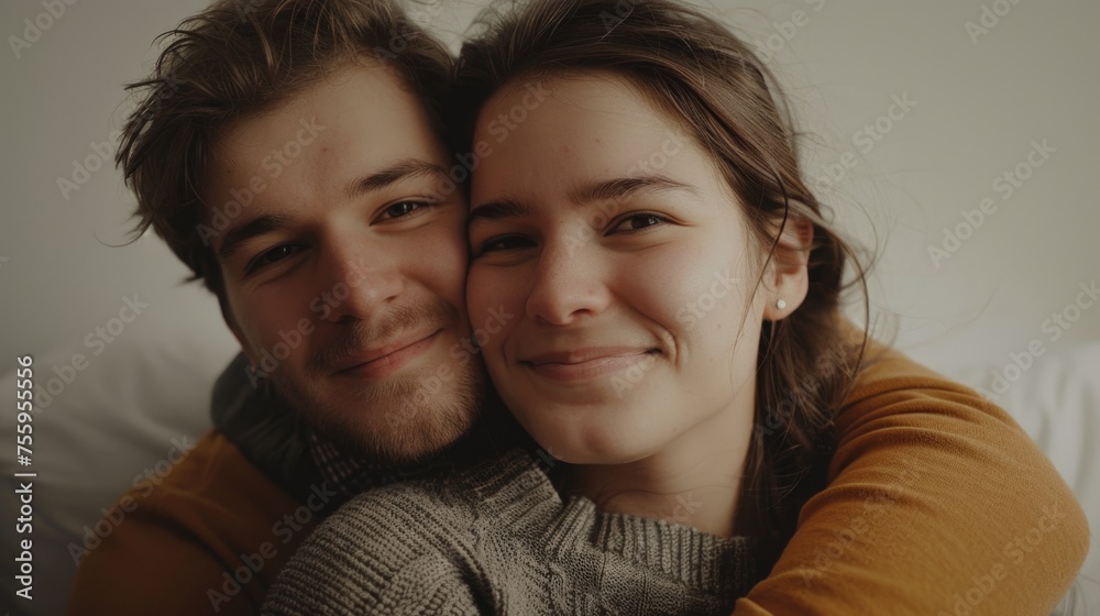 Φωτογραφία Intimate moment captured of a man and a woman embracing on a bed