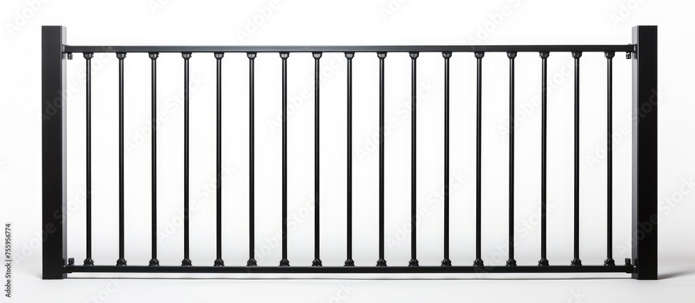 A monochrome photograph of a black metal fence contrasts against a snowy white backdrop, resembling a keyboard layout. The rectangular shapes form a uniform pattern, creating a visual slope