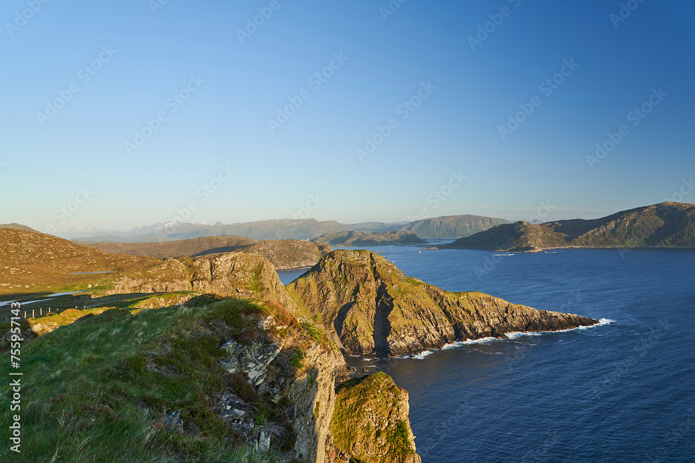 steep cliffs in the landscape of Runde island during sunset.
