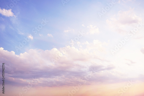 Blue purple lilac orchid pink peach white orange gold yellow cloudy evening sky background. Sunset clouds sun dawn summer. Delicate light pale pastel soft shades. Calm twilight sleep dream fantasy.