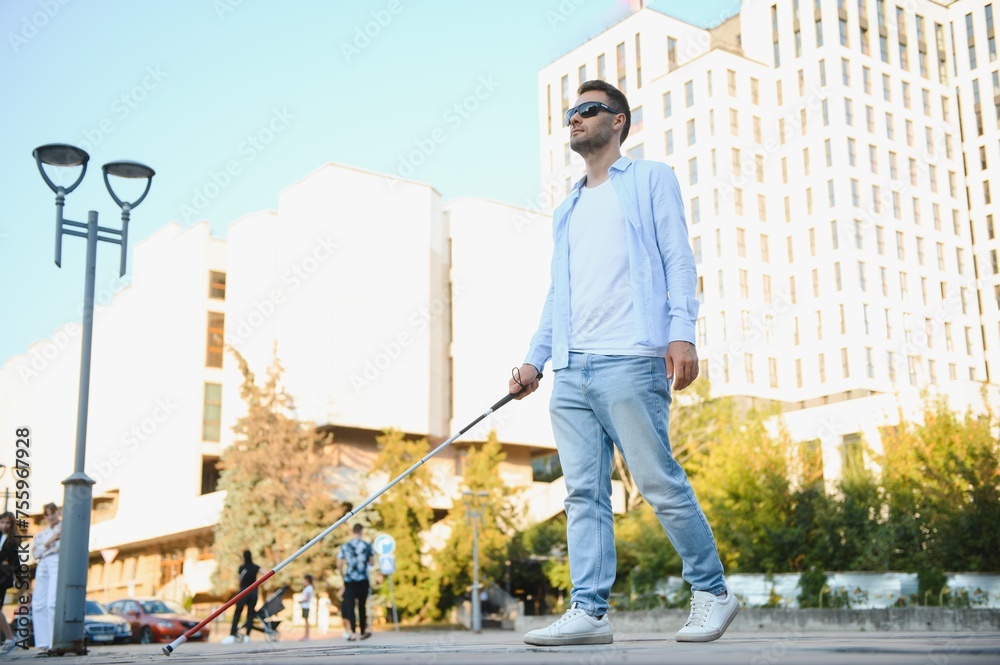 Blind man. Visually impaired man with walking stick, Blind man. Visually impaired man with walking stick,