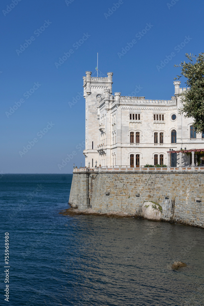 Trieste, Italy - September 26, 2023: 19th-century eclectic style Miramare Castle (Castello di Miramare), located directly on the Gulf of Trieste of the Adriatic Sea