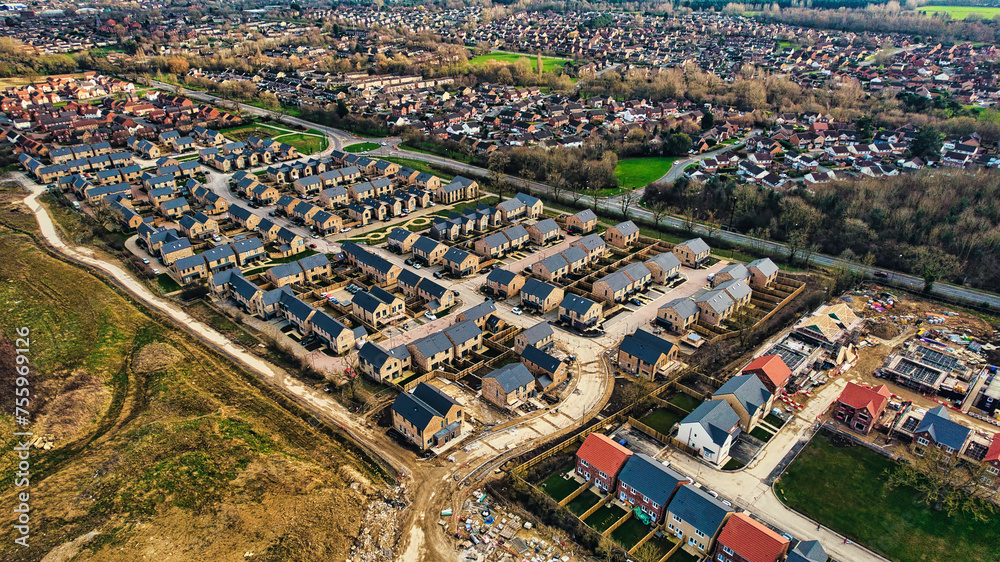 Aerial view of a suburban neighborhood with rows of houses, showing development and urban planning in Harrogate, North Yorkshire.