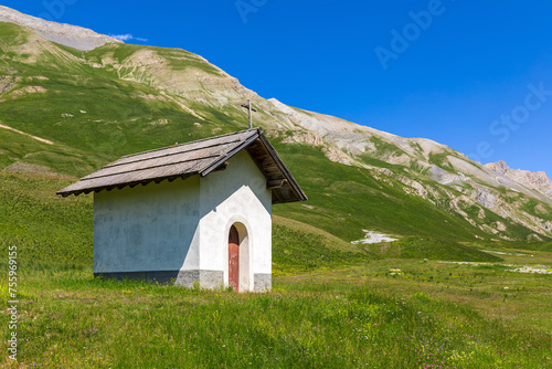 Small chapel on alpine meadow in France.