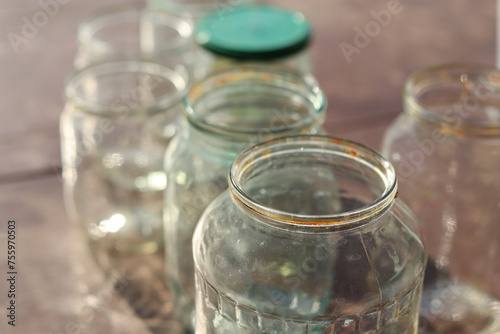 Empty washed glass jars in sunlight.