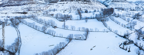 Winter landscape covered in snow in Guarguero waterfalls around port of Estacas de Trueba. Aerial view with drone. Espinosa de los Monteros. Pasiegos Valleys. Burgos. Castile and Leon. Spain. Europe photo
