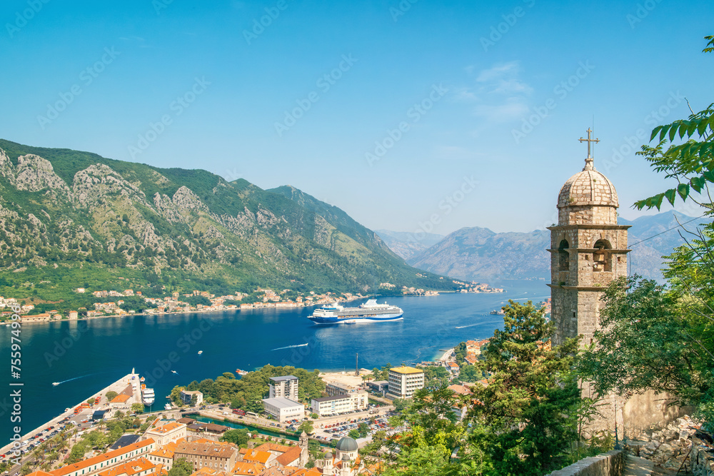 Kotor bay with medieval church and old town from Lovcen Mountain, Montenegro. Adriatic fjord with boats and cruise ship in summer day. Travel destination