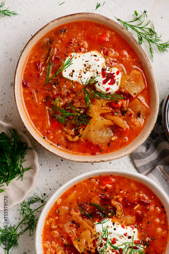 Cabbage rolls soup in a ceramic bowl on a table.  .style hugge