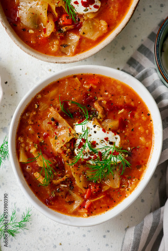 Cabbage rolls soup in a ceramic bowl on a table.  .style hugge