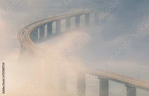 foggy bridge over the river photo