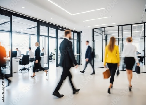 Bright business workplace with people in walking in blurred motion