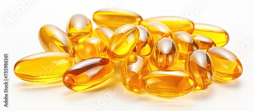 A pile of fish oil capsules in amber liquid form, resembling natural material. The capsules sit on a white background, reminiscent of glass jewellery or fashion accessory