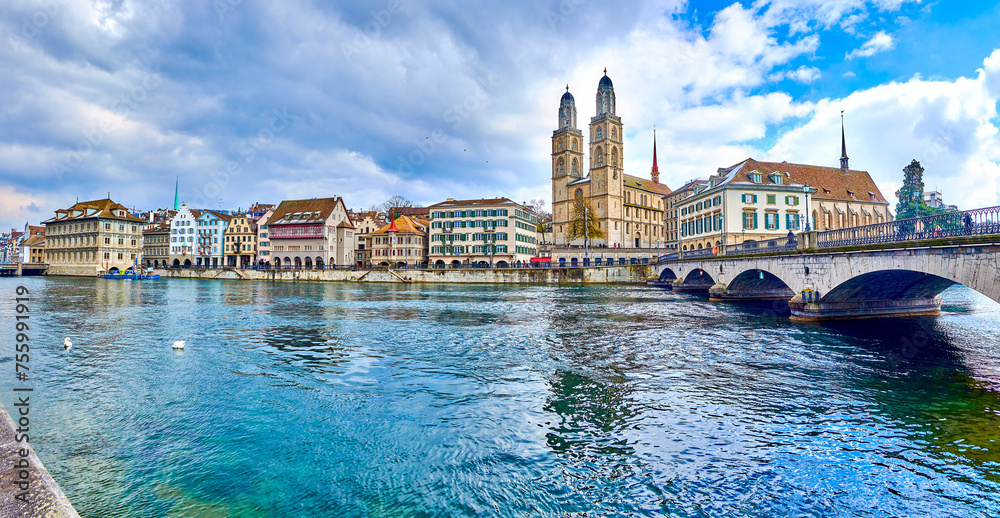 Limmat river with Munsterbrucke bridge and Grossmunster with houses on the river's bank, Zurich, Switzerland