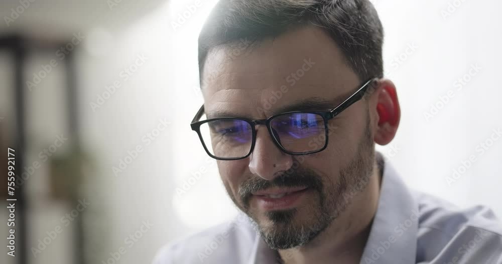 Portrait of smiling businessman entrepreneur working on computer, laptop screen reflecting in glasses, analyzing finance data Portrait of smiling businessman entrepreneur working on computer, laptop screen reflecting in glasses, analyzing finance data
