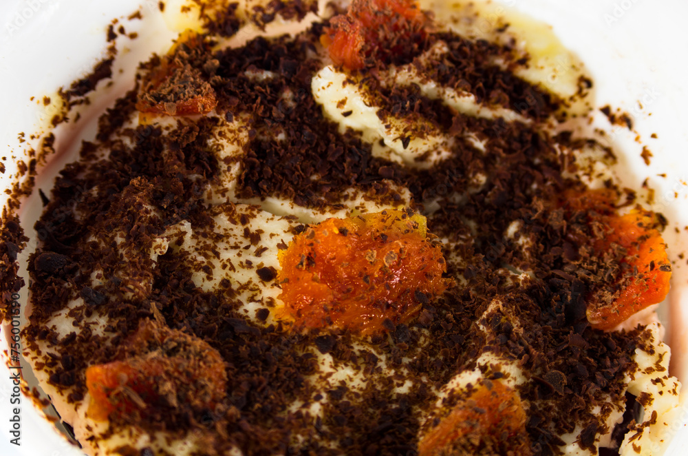Curd dessert with dried apricots, top view, close-up Curd dessert with dried apricots, top view, close-up