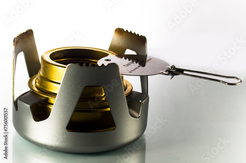Camping alcohol burner on white background