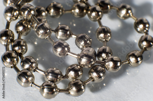 Silver chain close-up on white background